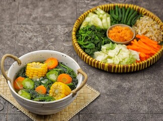 Sayur bayam bening or spinach clear soup in bowl
