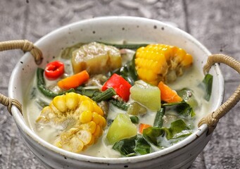 Sayur bayam bening or spinach clear soup in bowl