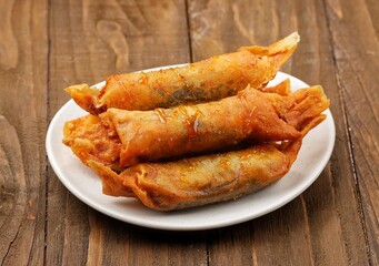 Piscok, Pisang Coklat Karamel. Caramel Chocolate banana is snack made from bananas. Banana Caramel itself is made from a combination of banana with chocolate jam coated in spring roll skin 