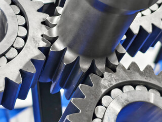 Close-up view of interconnected gears in a mechanical assembly showcasing precision engineering and...