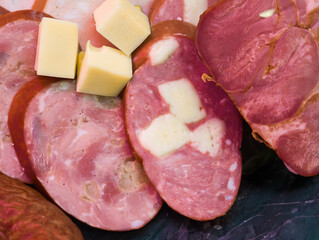 Delightful selection of cured meats paired with creamy cheese cubes ready to tantalize taste buds at a casual gathering