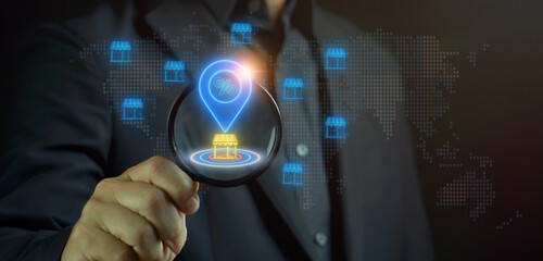 Neon location pin with percentage icon behind a glowing store on target, representing ideal business location, retail strategy, market positioning, discount offers, and storefront marketing success.