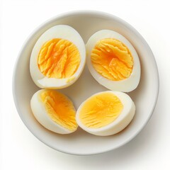 Four halved hard-boiled eggs in a small white bowl
