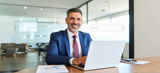A portrait of a professional working in a modern office. A business concept with people and graphics.