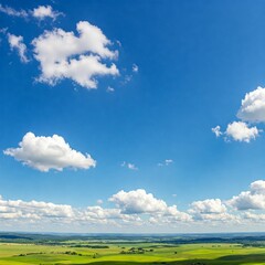 Clouds in the vast sky with light green grass fields