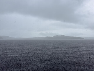 A west coast rains storm on a wild untouched lake.
