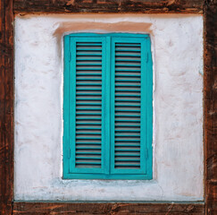 Vintage Wooden Window in Old Plaster Covered Wall.