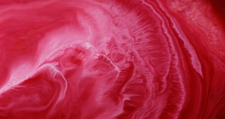 Shimmer paint. Abstract ink. Defocused red crimson color water glitter fluid acrylic particles...