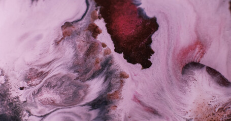 Mix paint. Ink flow. Defocused red bronze brown color acrylic liquid fluid wet pigment spreading on...