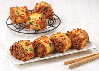Floss Roll Bread is a combination of shredded meat wrapped in soft bread, then rolled and cut into several pieces.