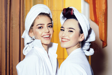 Beautiful women enjoying a romantic morning together. Pretty girlfriends sharing a tender moment....