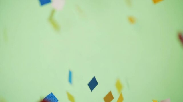 Burst of colorful confetti exploding over chroma green (#00FF00) background, ideal for celebration scenes, 4K, isolated on white background