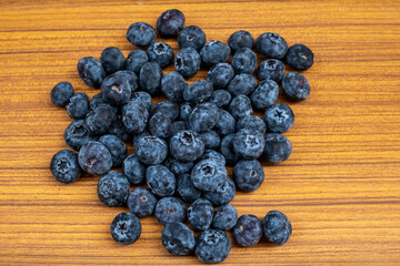 Close-up of Fresh Blueberries on wooden background. Blueberry top view image.