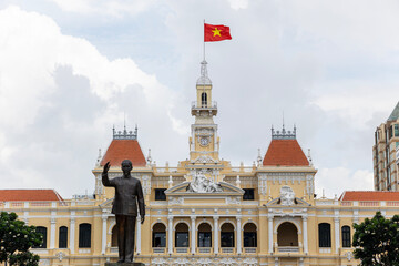 Ho Chi Minh city, Vietnam-June 25, 2025: At District 1 Statue of President Ho Chi Minh waving his hand in front of Ho Chi Minh City People's Committee building. View point for tourism.