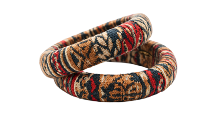 Intricate fabric bracelets layered on white background