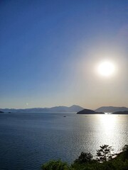 Fototapeta premium Ocean View with Blue Sky, Mountains, and Sea in South Korea