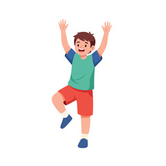 A joyful young boy raises arms and leg in a celebratory pose.