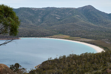 The iconic crescent shaped beach from the Wineglass Bay Lookout - Freycinet Peninsula, Tasmania, Australia