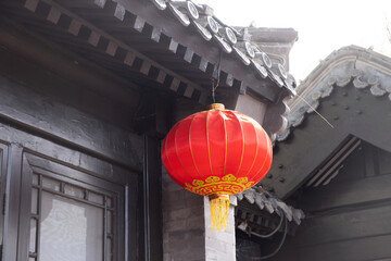 Red chinese lantern hanging from the roof. Oriental temple decoration