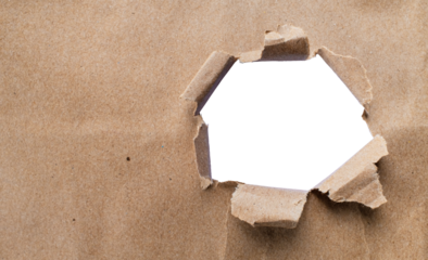 Torn brown kraft paper and holes on the sides