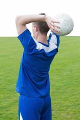Football player throwing ball