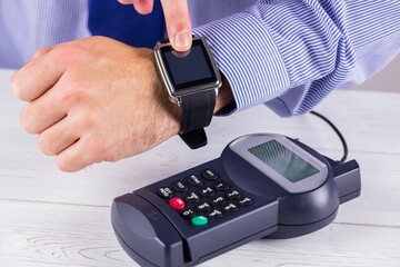 Man using smart watch to express pay