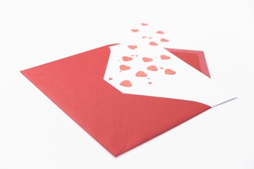 Illustrative image of hearts coming from red envelope