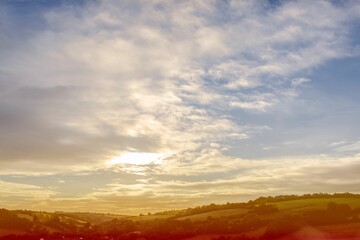 Scenic landscape with blue cloudy sky