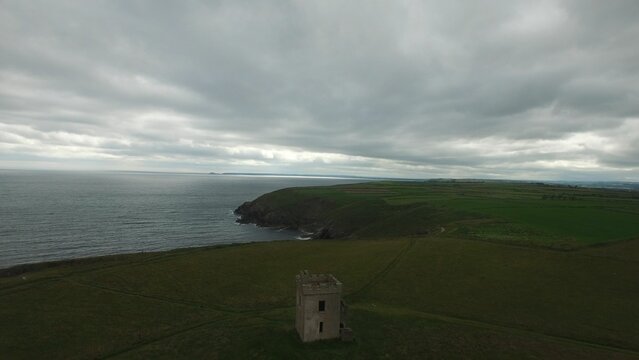 Fototapeta Scenic view of sea and hill