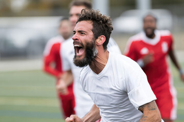 A soccer player celebrates a goal