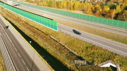 Top-down view of highway and green barriers
