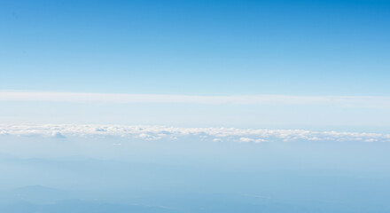 Fototapeta premium Aerial View of Clear Sky and Distant Clouds