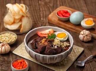 Rawon is a typical Indonesian dish originating from Ponorogo, East Java, which is a black meat soup...