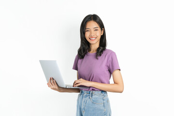 Young Asian woman holding laptop on white background.