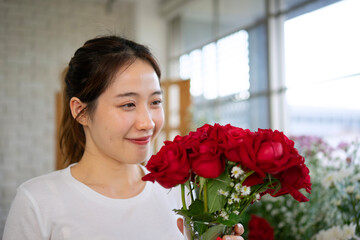 Young entrepreneurs are working at florist shop.
