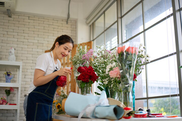 Young entrepreneurs are working at florist shop.