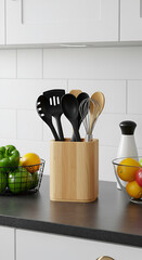Wooden utensil holder filled with various kitchen tools, on a countertop with fresh produce.