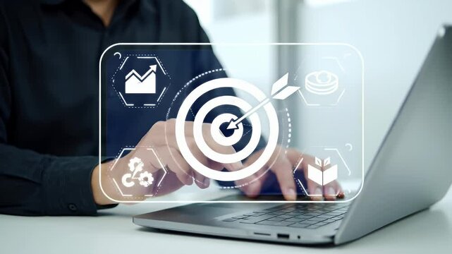 Businessman Typying on Laptop with Digital Interface of Goal and Strategy on White Table with White Background for Adobe Stock Photo