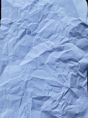 Crumpled Paper Texture: Captivating image featuring a single sheet of intricately folded paper, resulting in a rich display of shadow and form, textures.