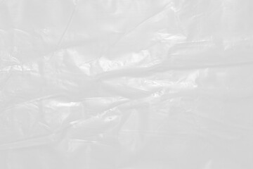 Obraz premium plastic overlay texture of realistic crumpled transparent plastic film wrap on black background,wrinkled stretched plastic effect. 