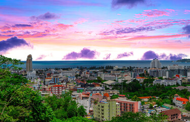 view of Patong and Patong Beach from the mountains colourful skies at Sunset. Patong is a vibrant city full of tourists from all around the world. 