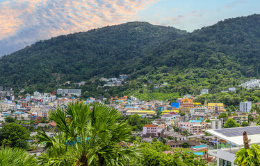 view of Patong and Patong Beach from the mountains colourful skies at Sunset. Patong is a vibrant city full of tourists from all around the world. 