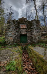 Barátság-forrás, or Friendship Spring, is a rustic stone-built forest spring set beneath tall...