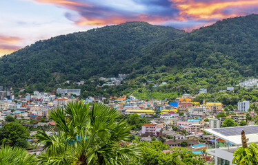 view of Patong and Patong Beach from the mountains colourful skies at Sunset. Patong is a vibrant city full of tourists from all around the world. 