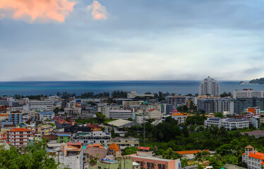 view of Patong and Patong Beach from the mountains colourful skies at Sunset. Patong is a vibrant city full of tourists from all around the world. 