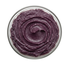 Close-up of a vibrant purple food spread in a glass container, showcasing its smooth texture