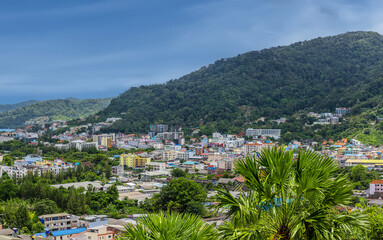 view of Patong and Patong Beach from the mountains colourful skies at Sunset. Patong is a vibrant...
