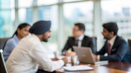 Defocused boardroom scene with Indian executives engaged in strategy meeting
