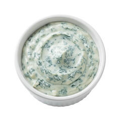 Creamy blue cheese dressing in a white bowl, garnished, with a rustic kitchen backdrop