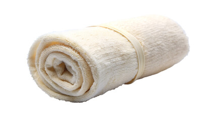 A soft, beige cotton towel is neatly rolled and isolated on transparent background